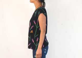 Leonard St black top with purple flower and bee print size 10 (note: some wash wear)