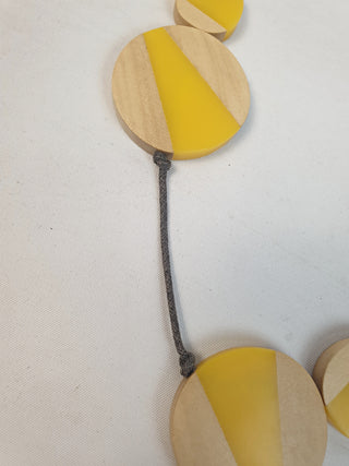 Wooden and yellow necklace with grey twine