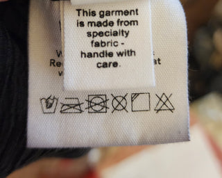 Kuwaii black ribbed skirt size 8 (large fit, best suits 10)