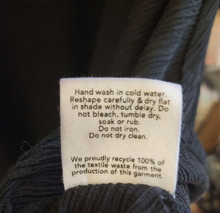 Kuwaii black ribbed skirt size 8 (large fit, best suits 10)