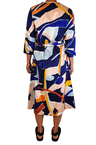 Multicolored abstract patterned dress on a white background